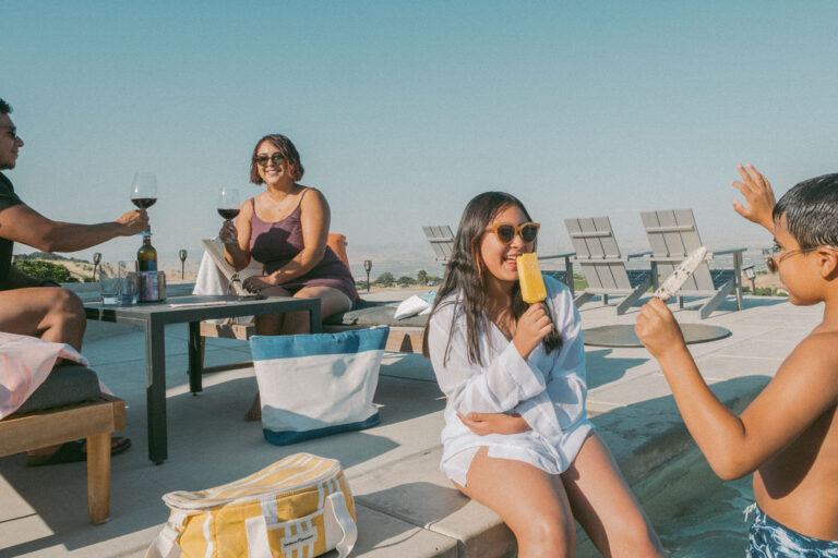 The Galindo family enjoying paletas around the infinity edge pool at the McPrice Myers hilltop guest house. Sunglasses courtesy of Specs by Kyla; styles from left to right: Gotti, Ahlem, Raen, Very French Gangsters. Photo credit: Richard Fusillo