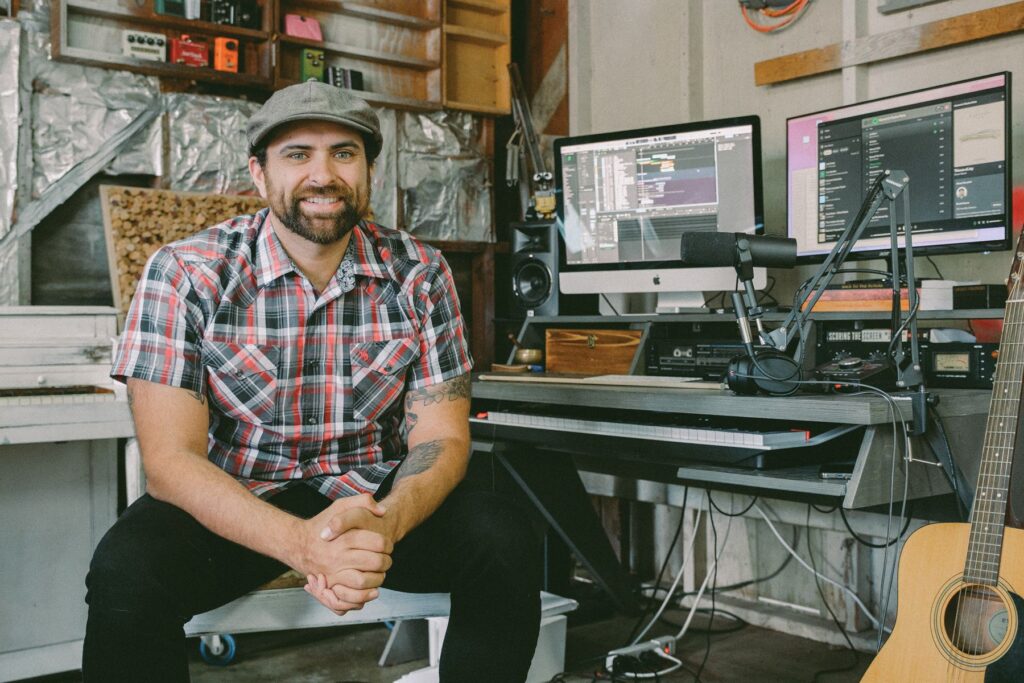 Brook sitting inside his studio