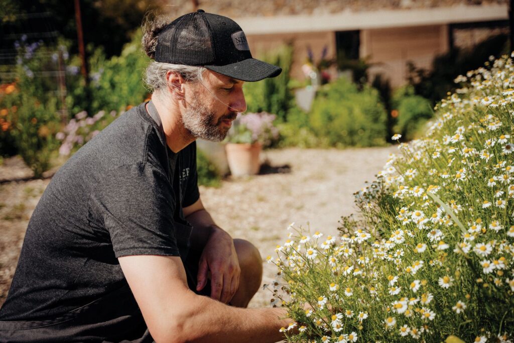 This page, clockwise from top left: Jacob spends time in the garden, which produces various elements that go into the Niner ecosystem