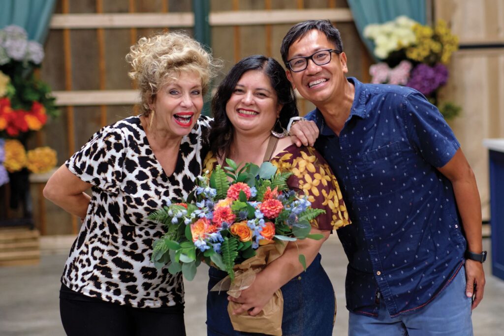 Three people posing for photo