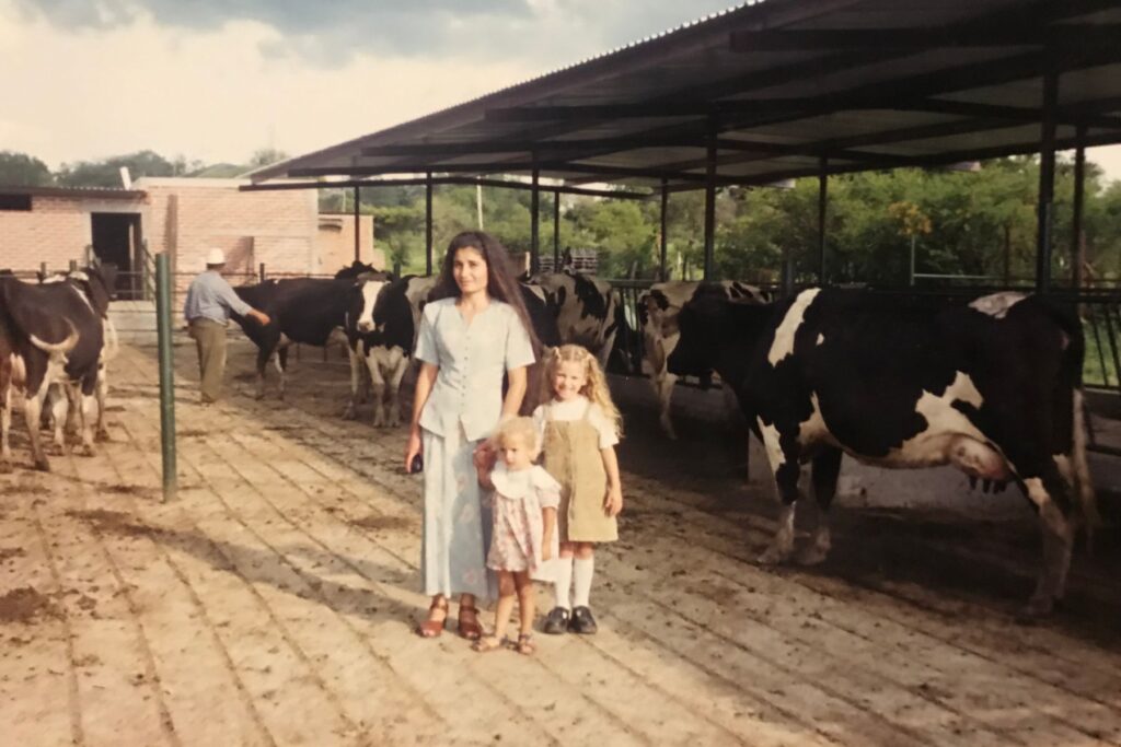 Woman and child among cows