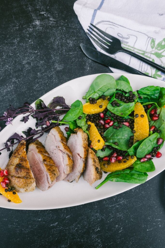 Christmas Duck Breast over Beluga Lentils and Wilted Greens