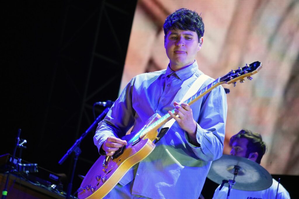 Ezra Koenig playing guitar