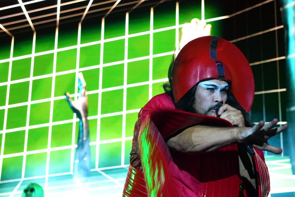 Singer of Empire of the Sun performing