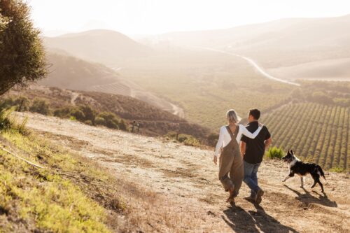 Wife and hustband team, Megan Shanley Warren and Justin Warren, walk the 100-acre farm.