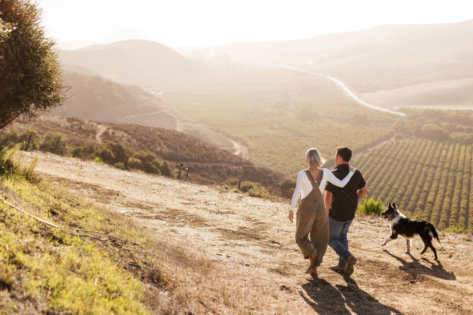 Wife and hustband team, Megan Shanley Warren and Justin Warren, walk the 100-acre farm.