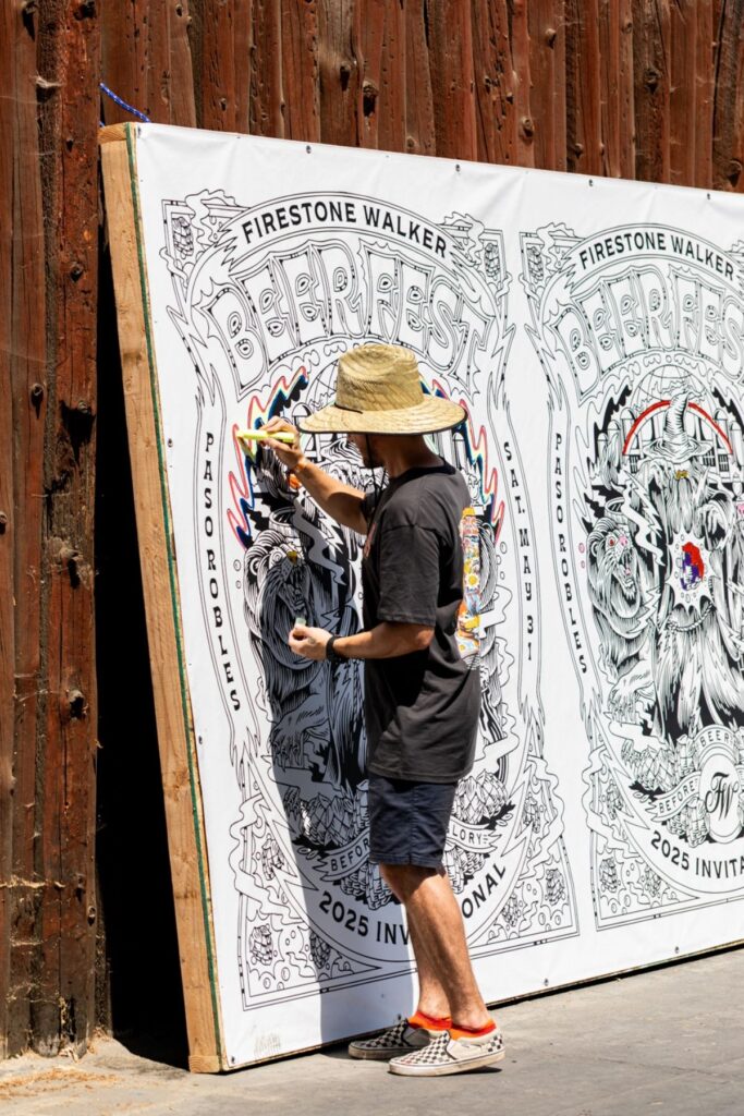 Person doing art on mural