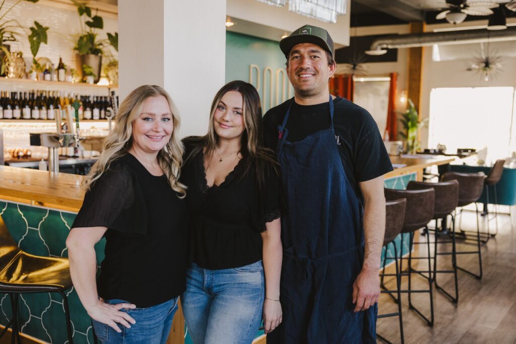 Family of three at their restaurant.