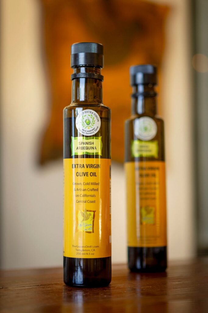 Two extra virgin olive oil bottles