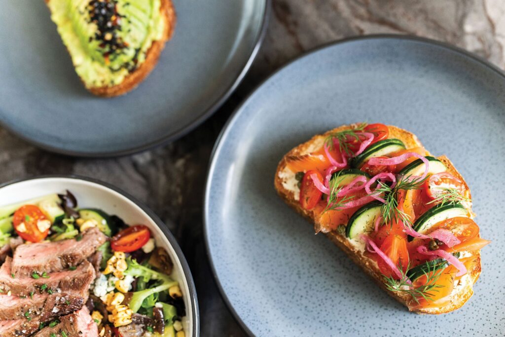Breakfast and lunch options are offered, including lox and avocado tartines.