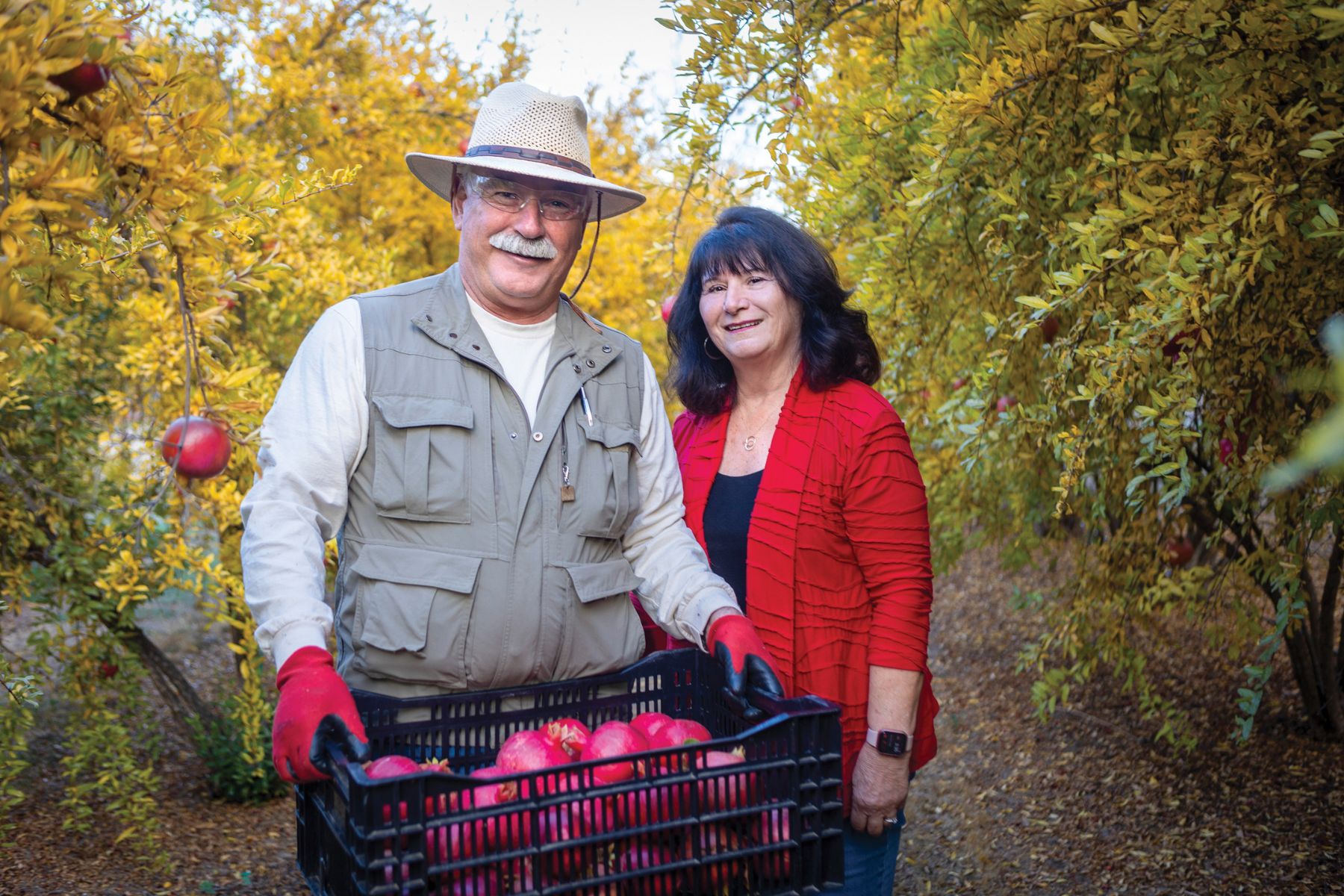 Co-owners George and Debra Sullivan stand proudly among the fruits of their labor.