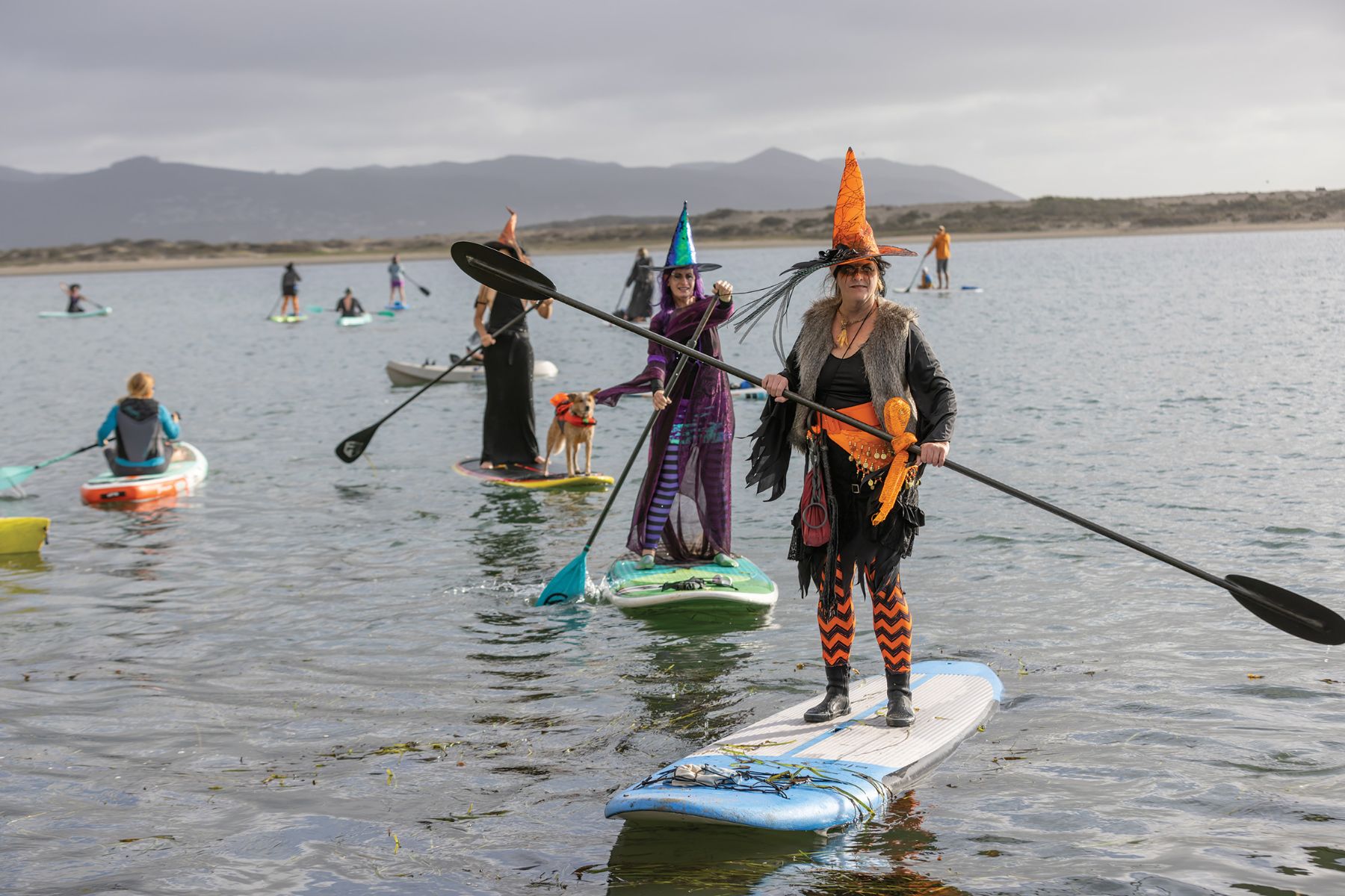 Women dresses as witches on a paddleboat.