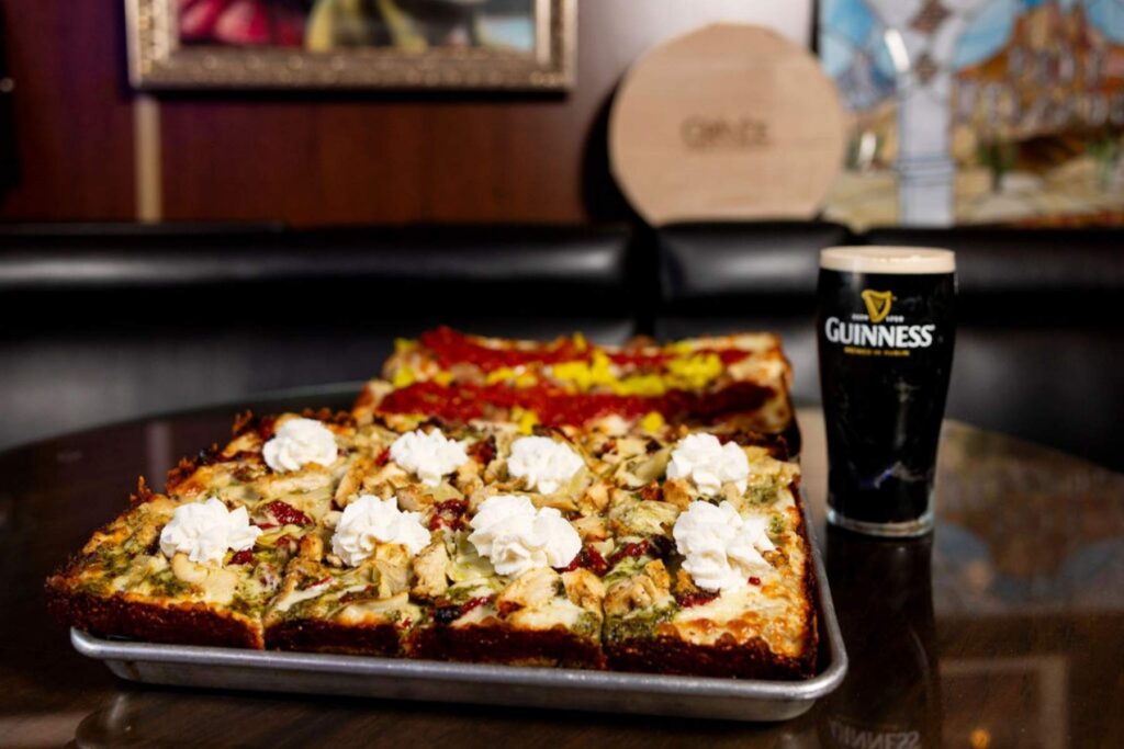 The Ba-Kaww pizza made with chicken, garlic, sundried tomatoes, artichoke hearts, ricotta and mozzarella cheeses, and pesto sauce.