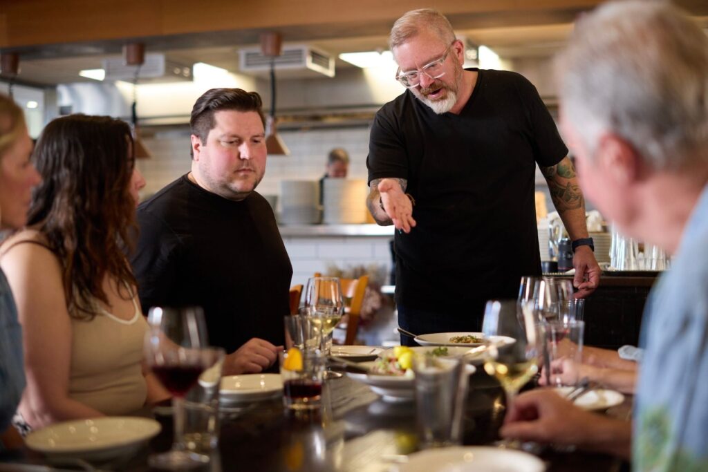 Etto Pasta Bar Executive Chef Marc LeDuc walks the Swopes through each dish before the meal begins.