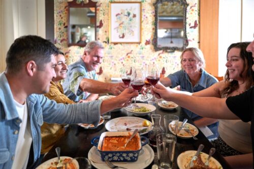 Around the table (left to right) Ryan Widell, Marin Wolgamott, Erik Meyers, Joy Meyers, and Emily Swope come together to celebrate the simple joy of sharing a meal.